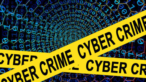 Netz binärer Zahlen, davor gelbes Banner mit schwarzer Aufschrift Cybercrime
